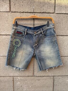 Distressed Denim Shorts with Green CHANEL Logo Accent